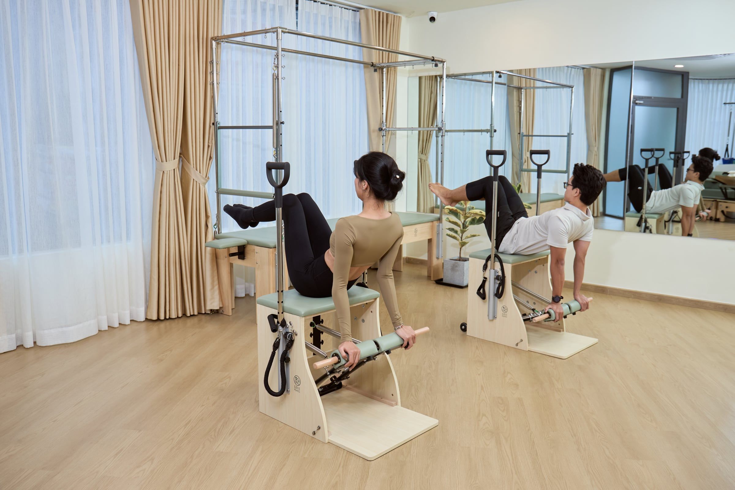 Two clients training side by side on Wunda Chairs
